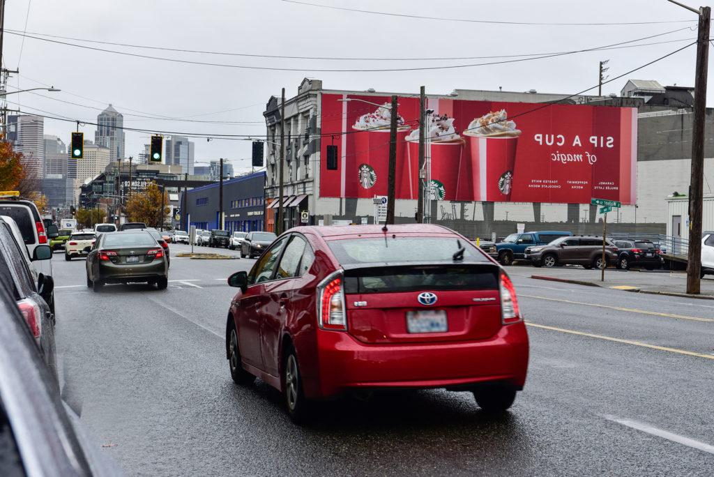 Large wallscape advertisement located in Seattle, Washington.